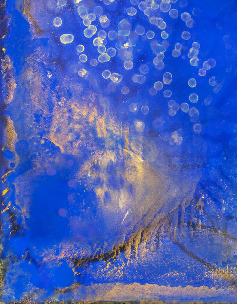 Painting with bright golden tones against deep cobalt, depicting the mesmerizing scene of fireflies illuminating a twilight sky.