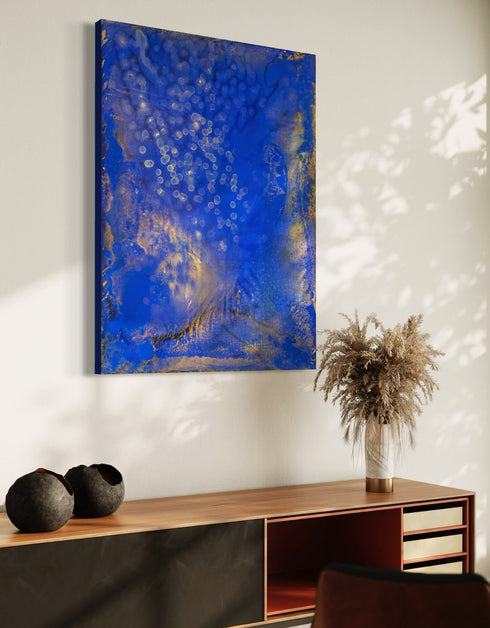 Painting with bright golden tones against deep cobalt, depicting the mesmerizing scene of fireflies illuminating a twilight sky.