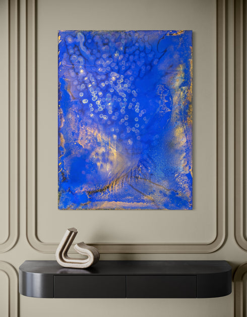 Painting with bright golden tones against deep cobalt, depicting the mesmerizing scene of fireflies illuminating a twilight sky.