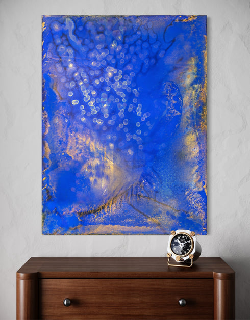 Painting with bright golden tones against deep cobalt, depicting the mesmerizing scene of fireflies illuminating a twilight sky.