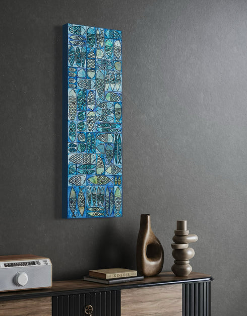 12"x36" painting with whimsical sardines in blues and greens, inspired by the charm of a tackle box.