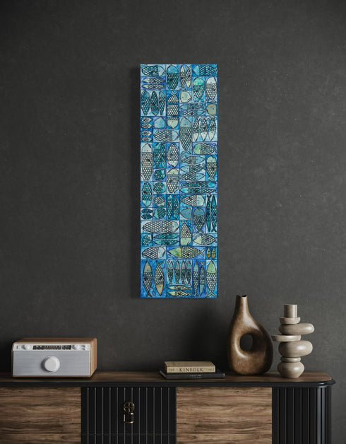 12"x36" painting with whimsical sardines in blues and greens, inspired by the charm of a tackle box.