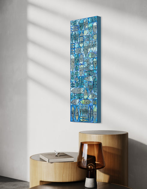 12"x36" painting with whimsical sardines in blues and greens, inspired by the charm of a tackle box.