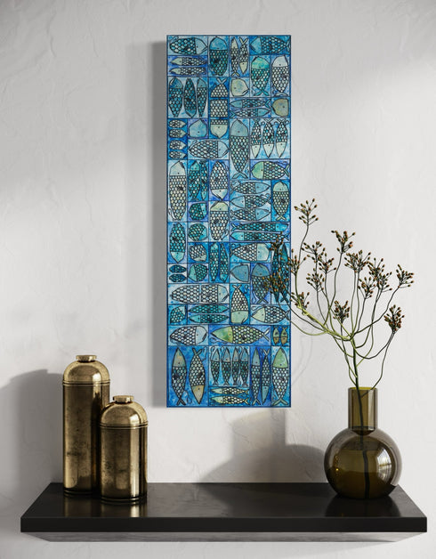 12"x36" painting with whimsical sardines in blues and greens, inspired by the charm of a tackle box.